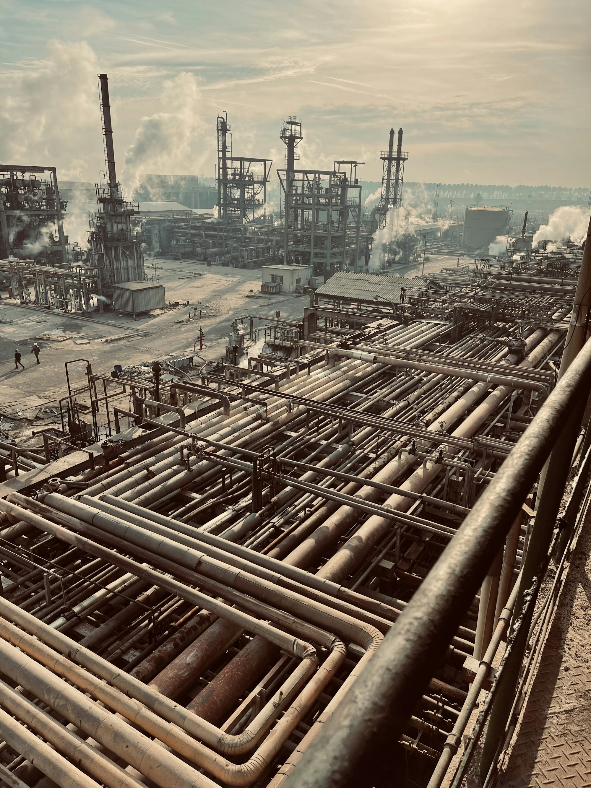 Expansive refinery with process towers, pipework and steam